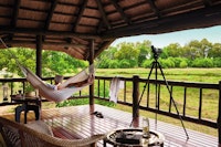Hammock on terrace at Khwai River Lodge, A Belmond Safari, Botswana