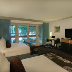 Bedroom with pool view at The Scott Resort & Spa