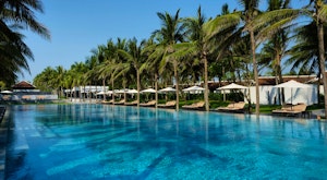 Experience a luxurious family summer getaway on Hoi An's white sandy beaches at a 5-star beachfront resort<place>Four Seasons Resort The Nam Hai, Hoi An, Vietnam</place><fomo>50</fomo>
