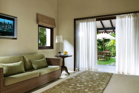 Room with outdoor seating at Vivanta by Taj Holiday Village